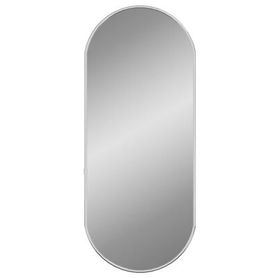 vidaXL Stensko ogledalo srebrno 60x25 cm ovalno