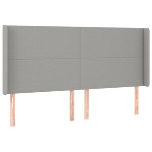 vidaXL Vzglavje z u&scaron;esi svetlo sivo 163x16x118/128 cm blago