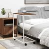 vidaXL Stranska mizica s kolesi bela 55x35x70 cm konstruiran les