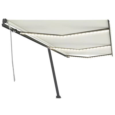 vidaXL Ročno zložljiva tenda z LED lučkami 600x300 cm krem